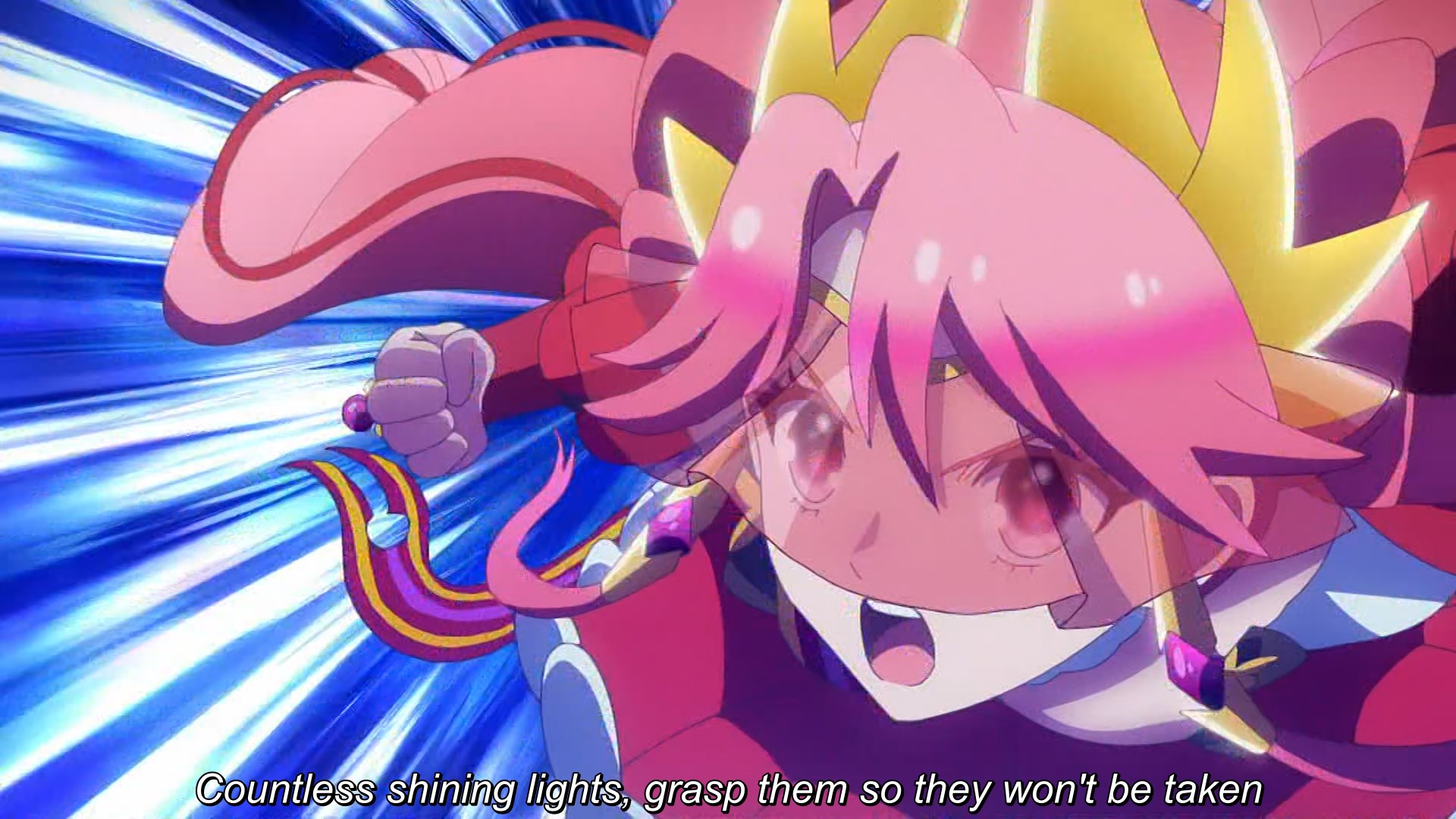 A pink haired woman is seeing her heart out as she pulls back her fist to pummel some sort of black robot thingie (not pictured). The subtitles read 'Countless shining lights, grasp them so they won't be taken'.